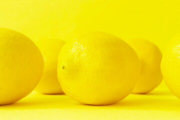 Lemon on yellow background　黄色背景上のレモン