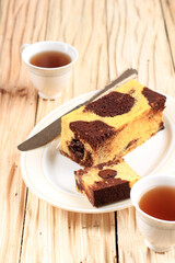 Slice of Marble Travel Cake, Mini Loaf Marble Cake with melted Chocolate Inside. Also Known as Tube Cake