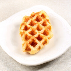 Croffle Croissant Waffle Isolated on White Plate. Popular Dish in South Korea