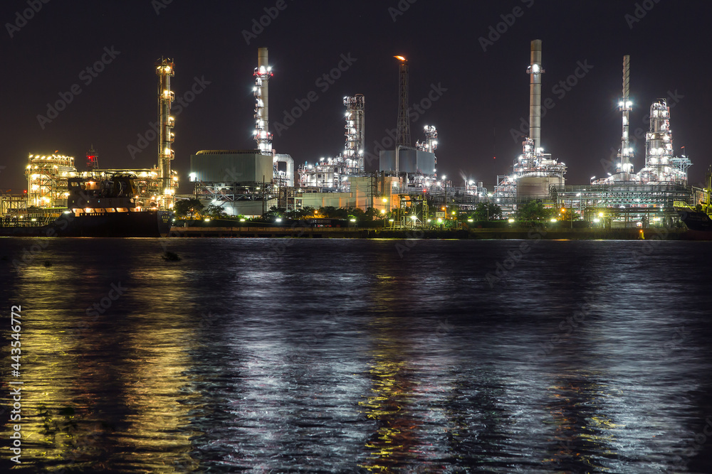 Wall mural oil refinery on water front at night