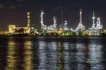 Oil refinery on water front  at night