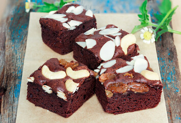 An image closeup cake or brownie chocolate flavor. a nuts sprinkle truffle dessert delicious is bakery tart homemade.