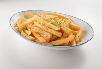 deep fried golden French fries with parmesan cheesy sauce in white background western snack cuisine...