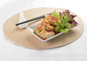 double boiled meat dumpling with spicy mala chilli sauce in white background asian halal menu