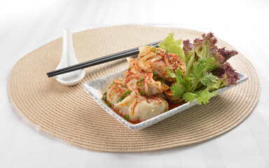 double boiled meat dumpling with spicy mala chilli sauce in white background asian halal menu