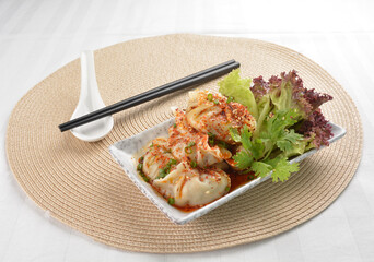 double boiled meat dumpling with spicy mala chilli sauce in white background asian halal menu