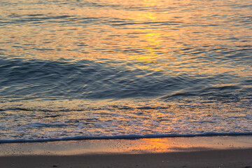 Morning sunrise light shining on ocean wave