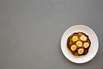 Homemade Banana Pancakes with Honey, top view. Flat lay, overhead, from above. Space for text.