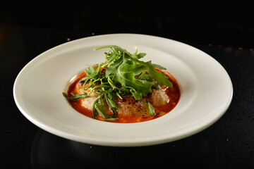 cheesy baked cheese meat ball with red tomato bolognese sauce and green vegetables in plate on dark bar counter restaurant western snack cuisine asian cafe halal appetiser menu