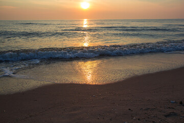 Morning sunrise light shining on ocean wave