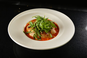cheesy baked cheese meat ball with red tomato bolognese sauce and green vegetables in dark bar counter background western cuisine halal menu
