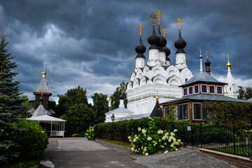 Fototapeta na wymiar Storm clouds over the Trinity Monastery in Murom town