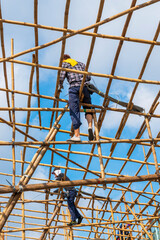 Construction workers in Bamboo Scaffolding