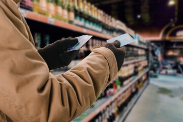 Man doing purchases in grocery shop with credit card