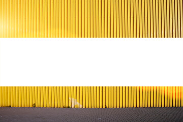 Long white blank advertising billboard on yellow steel fence or wall
