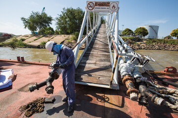 Male worker inspection and measurement thickness pipeline oil