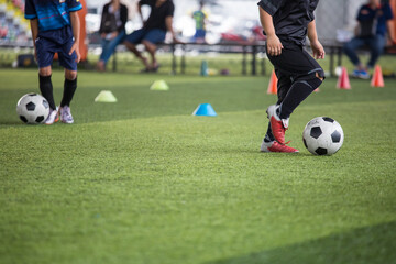  Boys Soccer ball tactics on grass field with cone