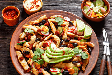 Mexican chicken salad on a plate, top view