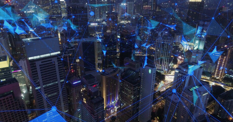 AERIAL. Network and Connection technology concept with Kuala Lumpur city at night time