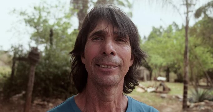 Latin man of indigenous descent on his farm. Brazilian farmer. 4K.