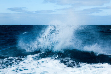 Ocean water background with foam. Ocean water splash. Not a calm 