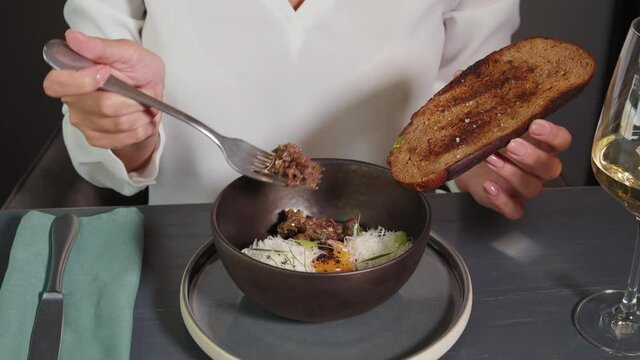 Beef Steak Tartare with russian bread toasts, tartar meat gourmet food