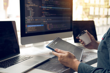Working in the morning with businessmen are dipping coffee that works with software developers to...