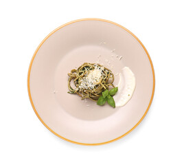 Plate with tasty pasta and spinach on white background