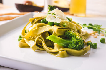 Plate with tasty pasta and vegetables, closeup