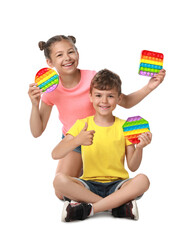 Children with pop it fidget toys on white background - obrazy, fototapety, plakaty