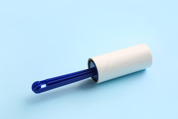 Lint roller on color background