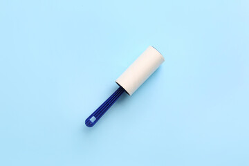 Lint roller on color background