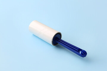 Lint roller on color background