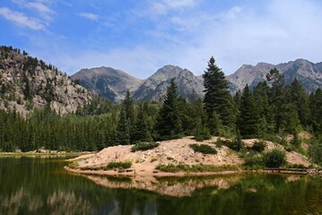 Fototapeta na wymiar panoramic view of potato lake and the west needle mountains on a sunny day in summer in the san juan national forest near durango, colorado
