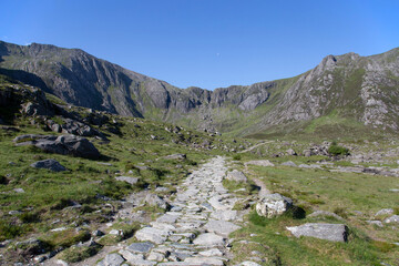 Stone mountain path trail at Cwm Idwal mountains, part of Snowdonia National Park,  on a sunny day