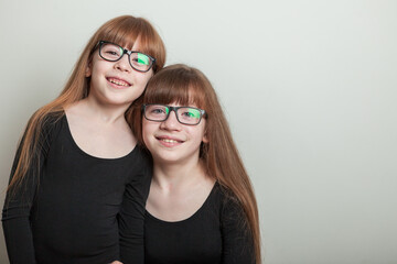 portrait of happy girls in a sports gymnastic swimsuit