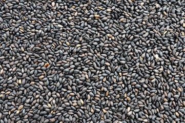 Organic black sesame seeds background.