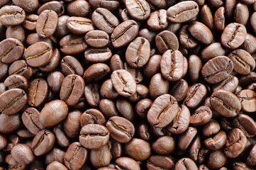 Closeup of coffee beans texture, coffee background.