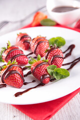 strawberry with chocolate sauce and mint