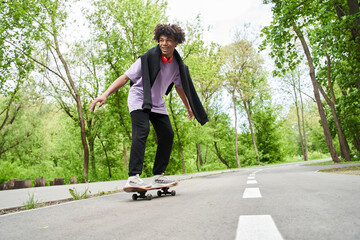 Man trying up skateboarding while enjoying extreme sport at the urban road