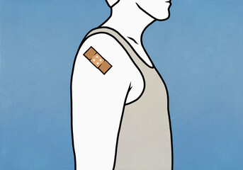 Man with Covid vaccine bandage on arm
