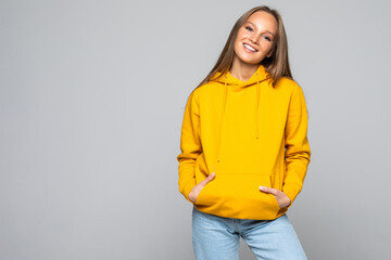 Young woman in yellow hodie isolated on white background