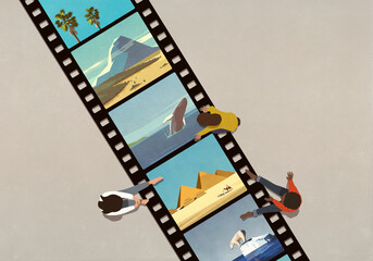 Friends looking at travel and nature photos on camera film
