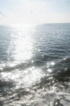 Sunshine reflection sparkling on ocean surface
