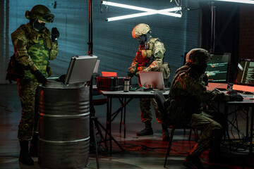 Group of crime fighters checking information devices in office