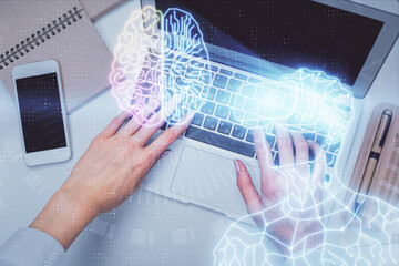 Double exposure of woman hands working on computer and man in ar glasses hologram drawing. Top View. Virtual reality concept.