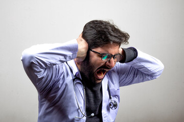 A doctor stressed frustrated at work freaking out