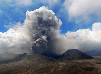 Mt. Bromo volcano actively erupts in bromo tengger semeru national park on a sunny day in east java, Indonesia