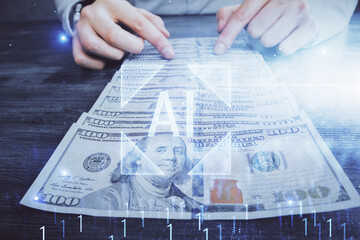 Double exposure of technology drawing hologram and us dollars bills and man hands. Data concept