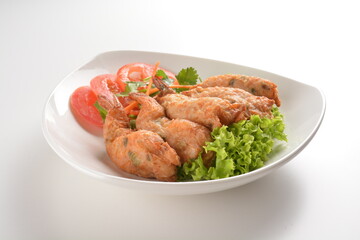 deep fried golden crispy prawn meat ball roll traditional wu Xiang with spicy sauce in white background asian halal snack menu